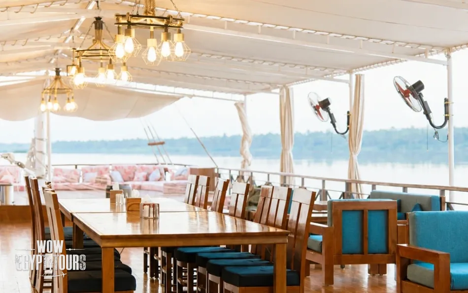 Open-air dining area on the sun deck of Fatima Dahabiya Nile Cruise
