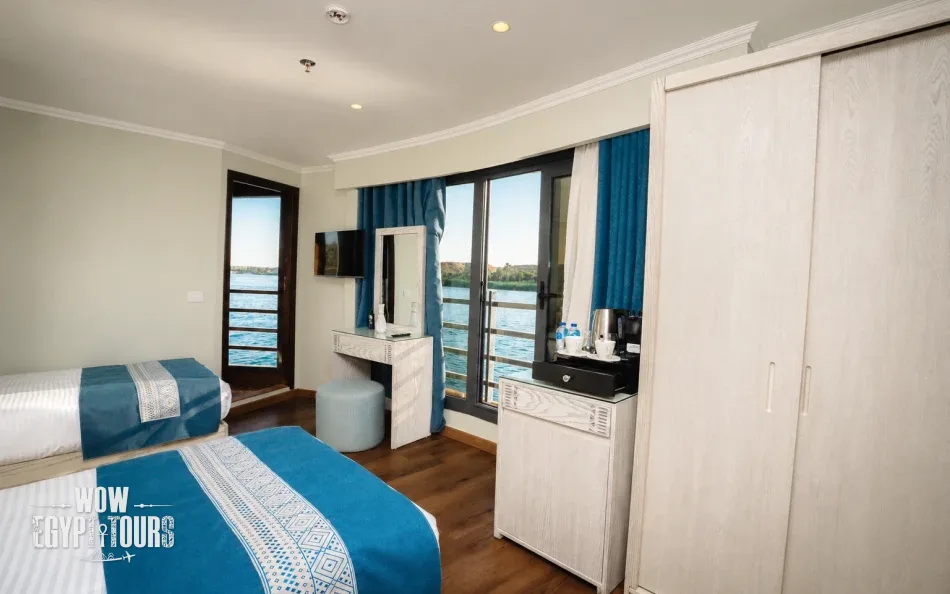 Spacious suite with a twin beds aboard Iris Dahabiya Nile Cruise