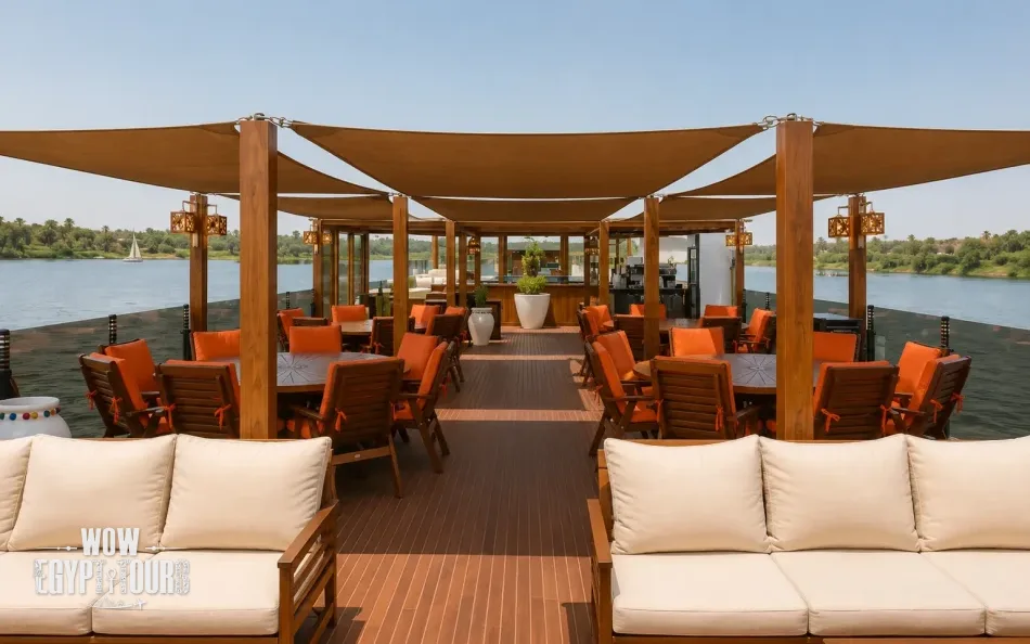Outdoor lounge seating on the sun deck of Iris Dahabiya Nile Cruise