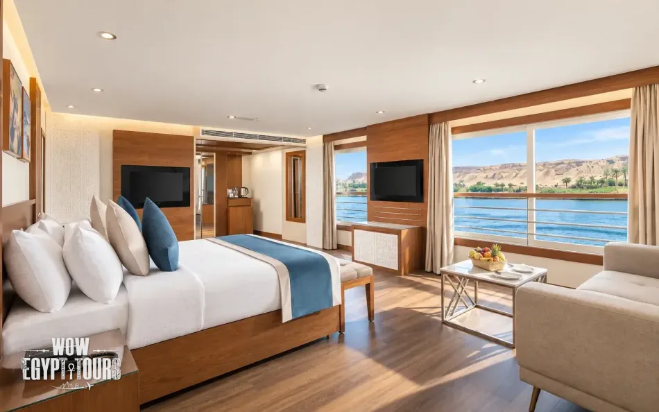 Spacious suite with bedroom and seating area aboard Nile Capital Nile Cruise