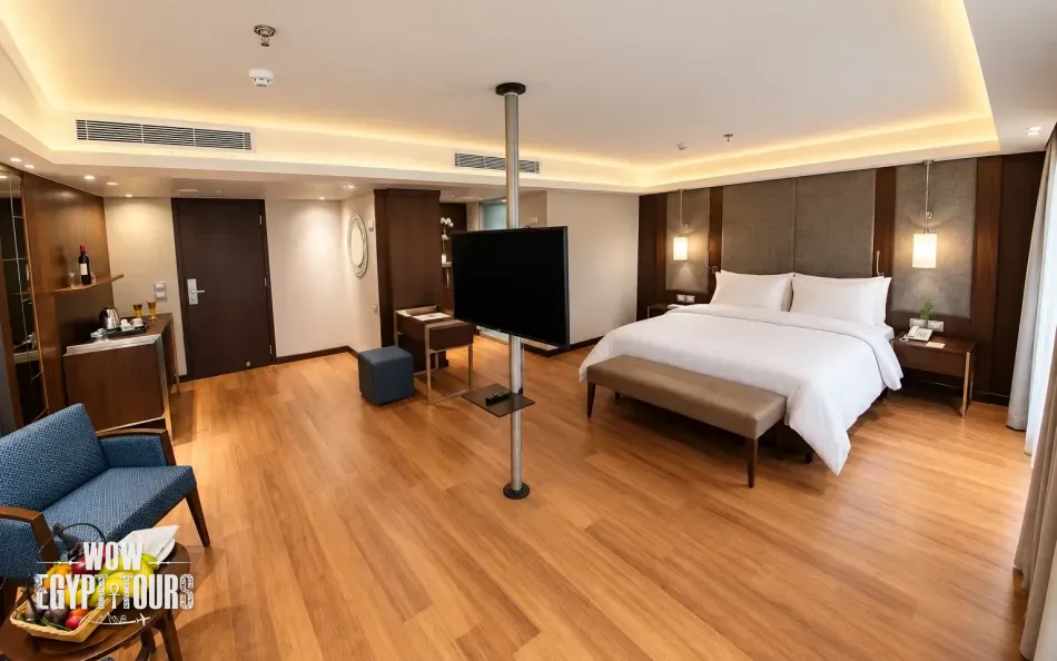 Spacious suite with bedroom and seating area aboard Concerto II Nile Cruise