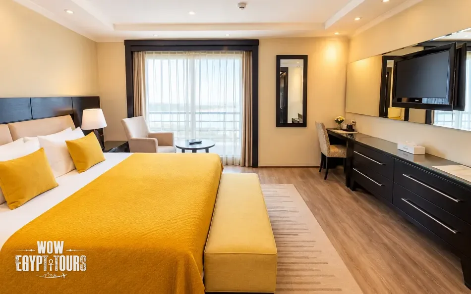 Double cabin with a large bed aboard Farida Nile Cruise
