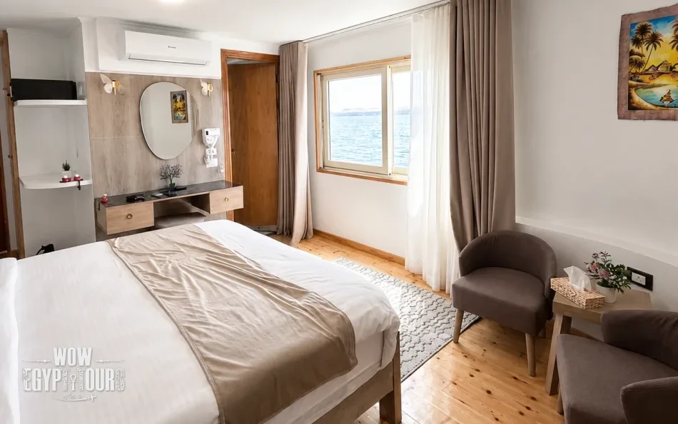 Double cabin with a large bed aboard Étoile d'Égypte Dahabiya Nile Cruise