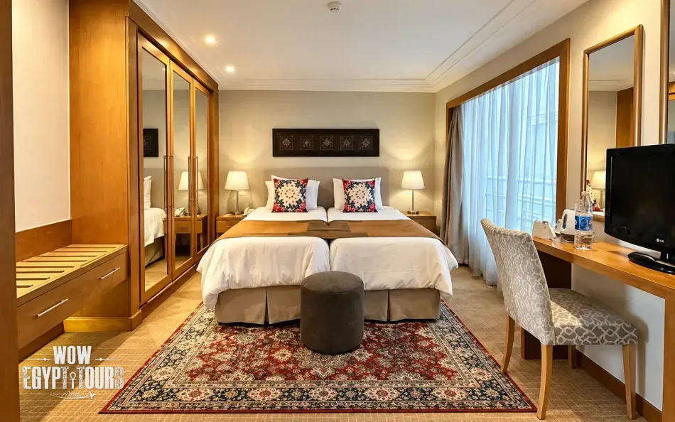 Double cabin with a large bed aboard Salima Nile Cruise