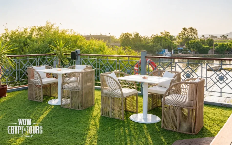 Outdoor dining tables on the sun deck of Merit Dahabiya Nile Cruise