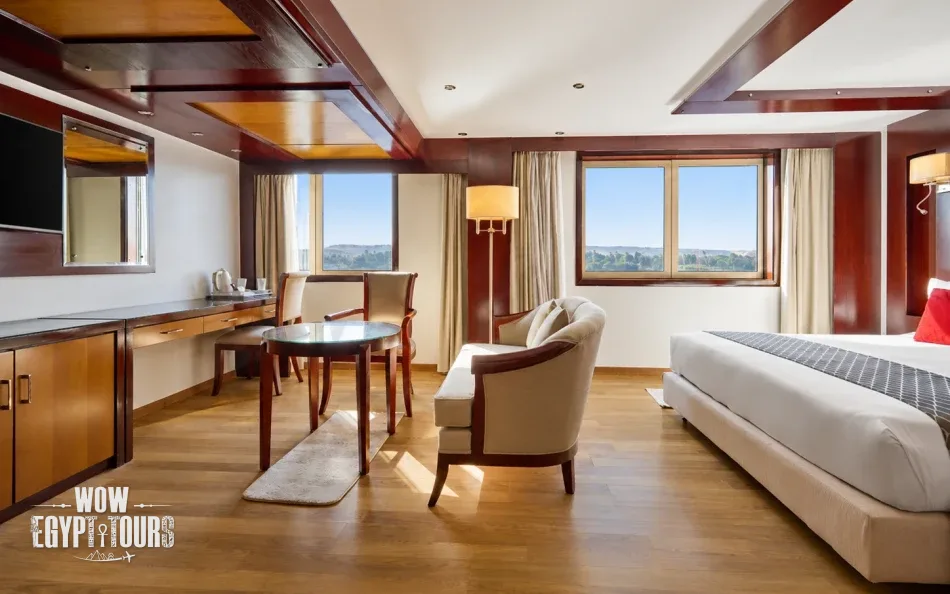 Spacious suite with a seating area aboard Blue Shadow Nile Cruise