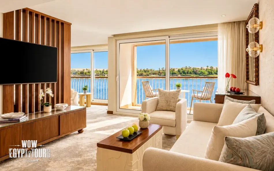 Spacious suite with seating area and Nile River views aboard Tulip Nile Cruise