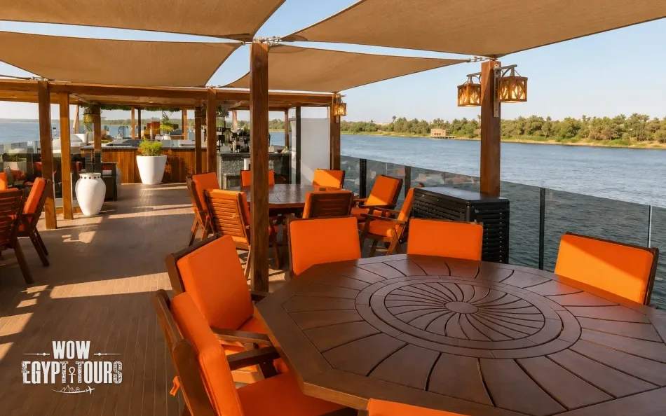 Open-air dining area on the sun deck of Iris Dahabiya Nile Cruise