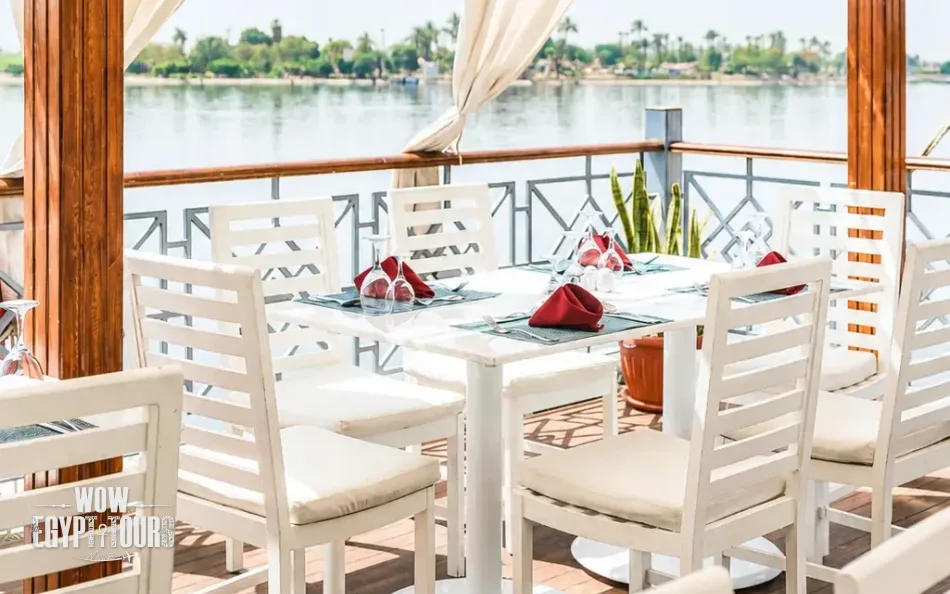 Open-air dining area overlooking the Nile aboard Merit Dahabiya Nile Cruise