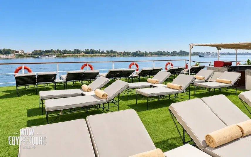 Outdoor seating and sun loungers on the sun deck of Jaz Bahareya Nile Cruise