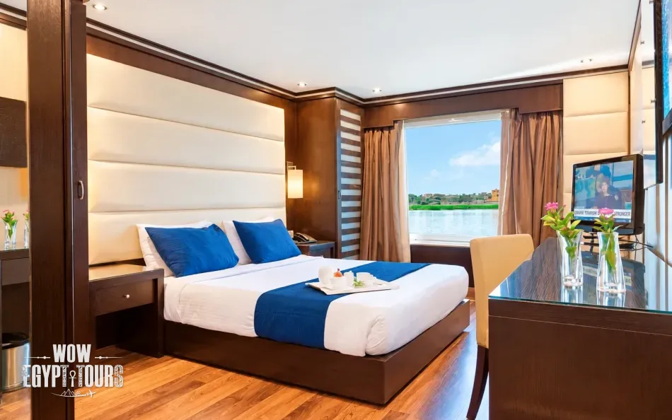 Double cabin with a large bed aboard Nile Premium Nile Cruise