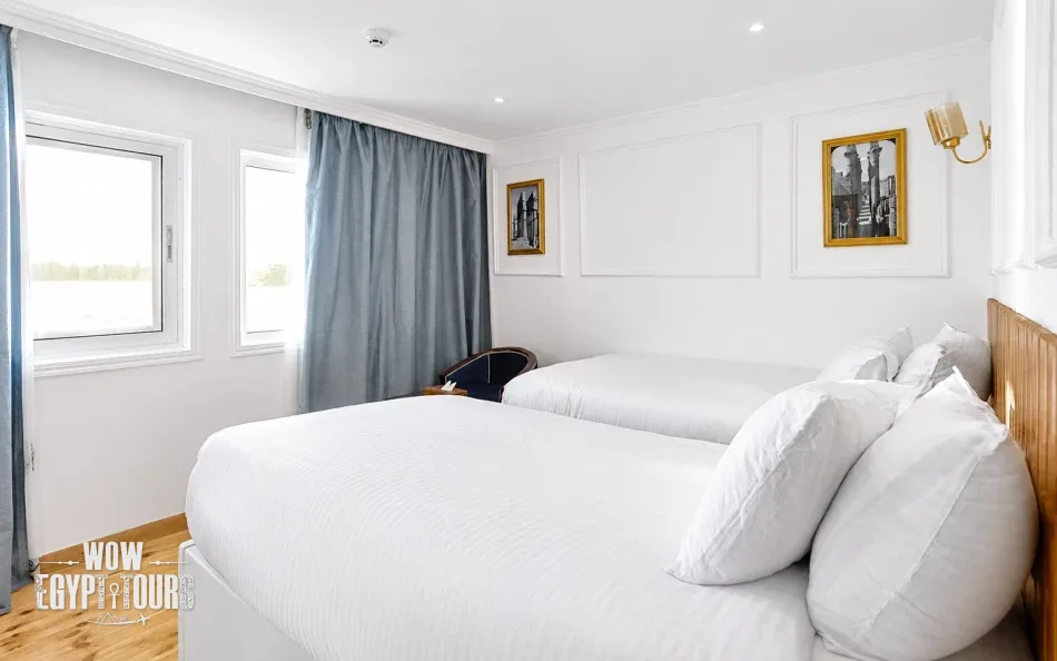 Double cabin with a large bed aboard Fatima Dahabiya Nile Cruise