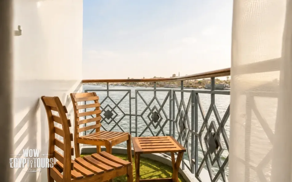 Private suite balcony with Nile River views aboard Merit Dahabiya Nile Cruise