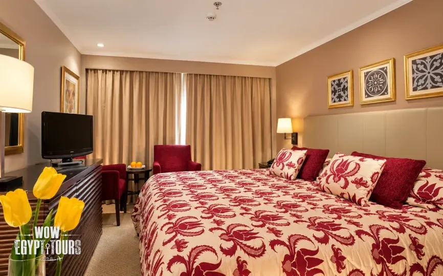 Double cabin with a large bed aboard Steigenberger Legacy Nile Cruise