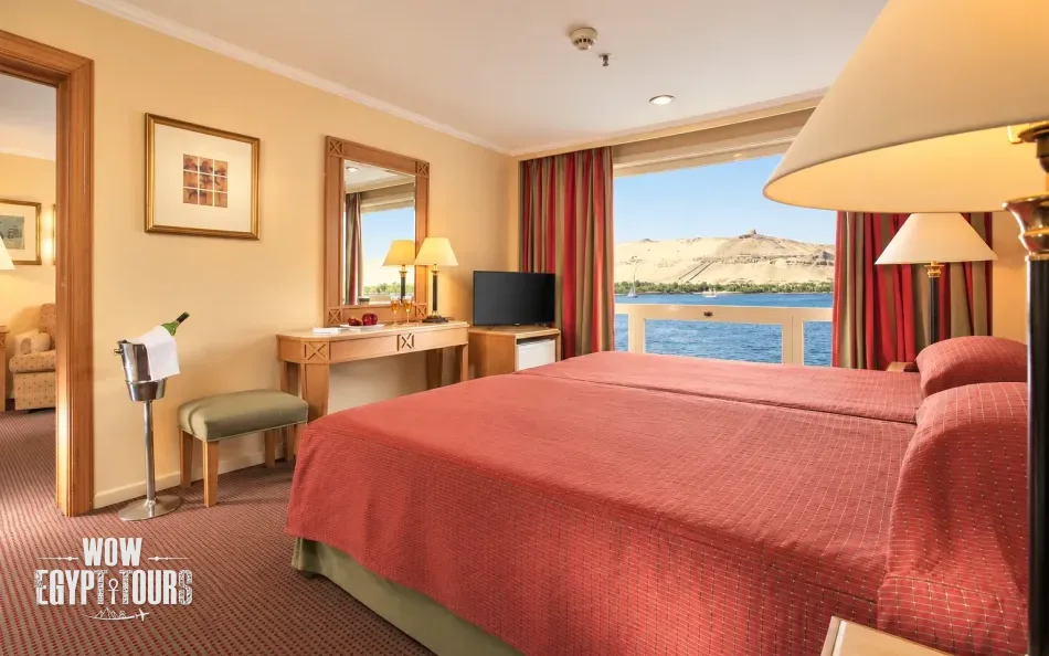 Spacious suite with seating area aboard Jaz Crown Emperor Nile Cruise