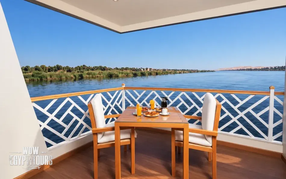 Private balcony overlooking the Nile River aboard Merit II Dahabiya Nile Cruise