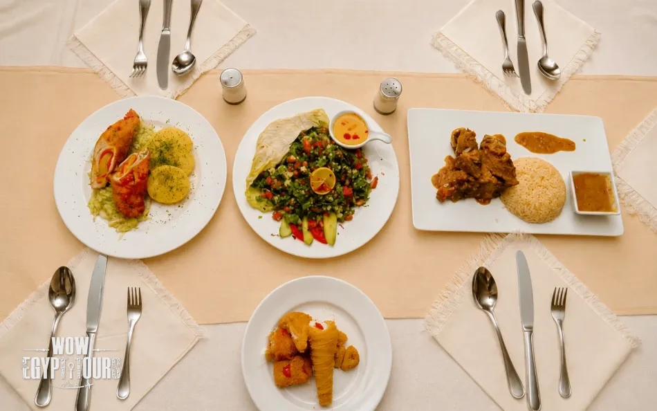 Dining table with meals served aboard Turquoise Dahabiya Nile Cruise