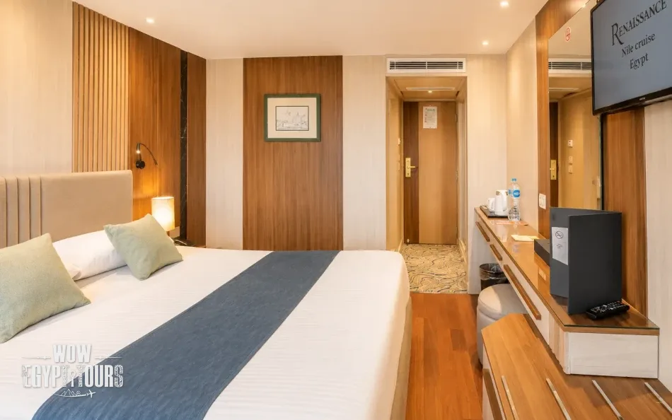 Double cabin with a large bed aboard Renaissance Nile Cruise