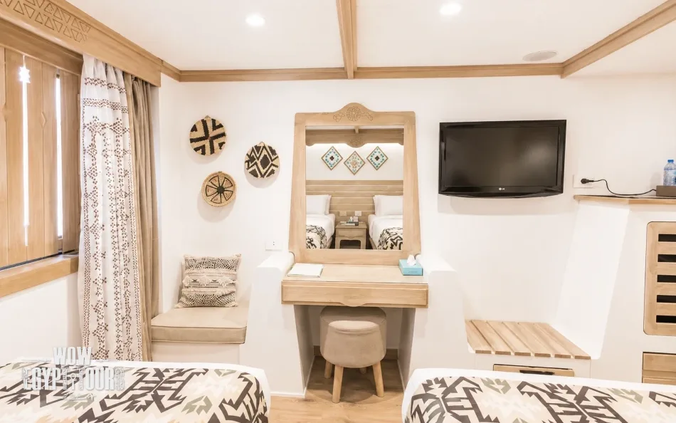 Cabin interior with vanity and television aboard Mahrousa Nile Cruise