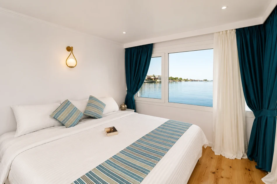 Double cabin with Nile River views aboard Turquoise Dahabiya Nile Cruise