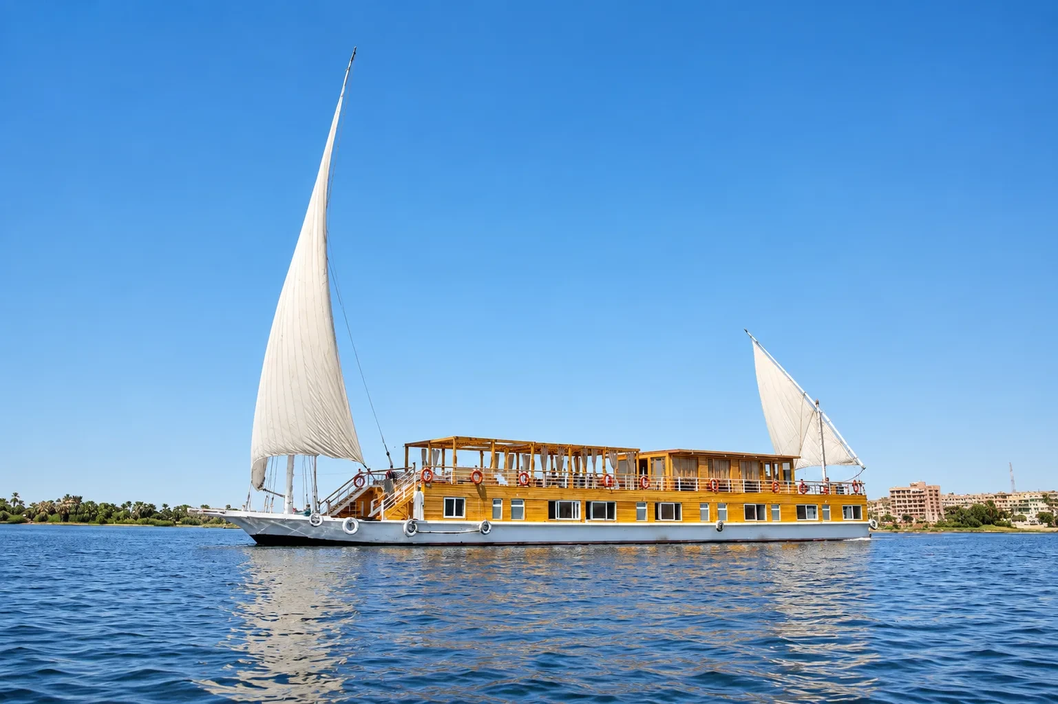 Akhnaton Dahabiya Nile River Cruise exterior on the Nile River