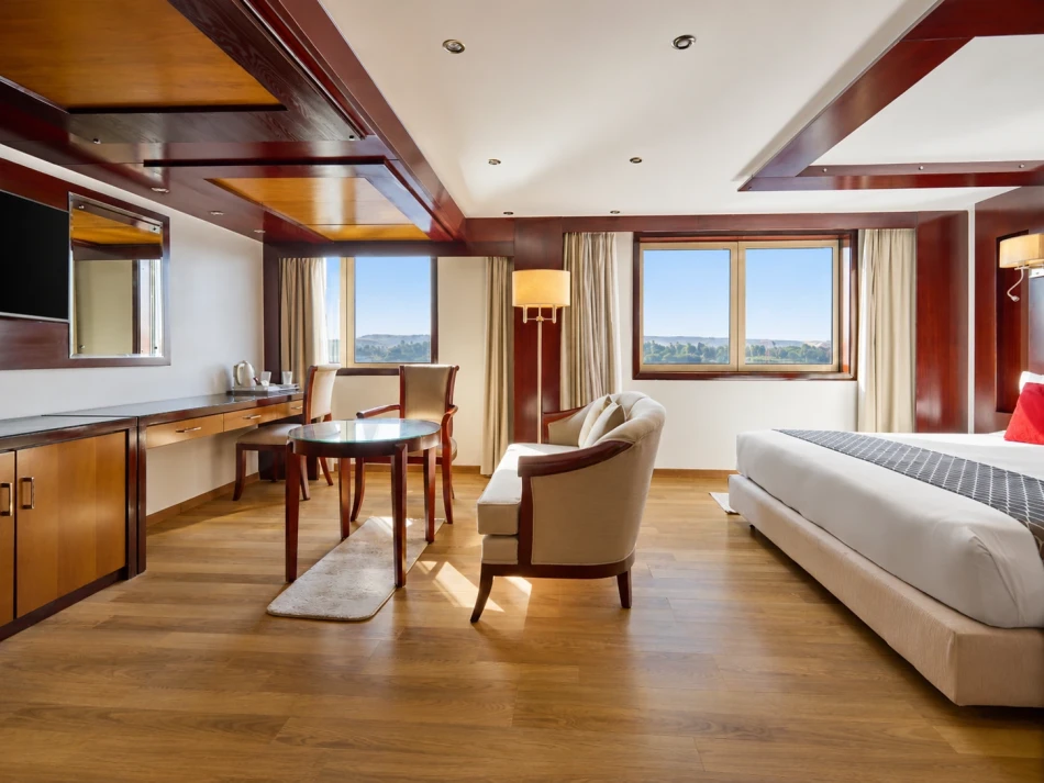 Spacious suite with a seating area aboard Blue Shadow Nile Cruise