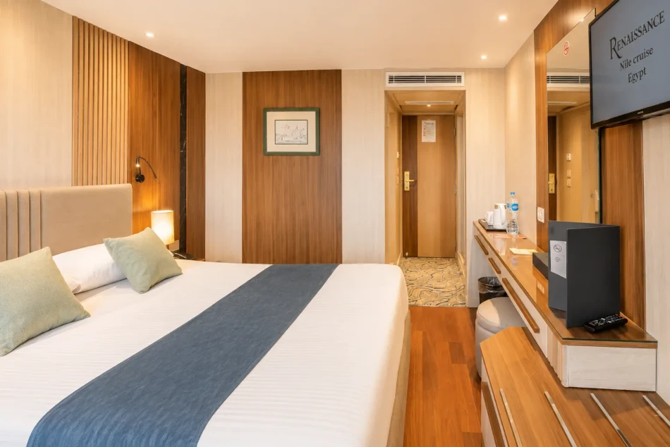 Double cabin with a large bed aboard Renaissance Nile Cruise
