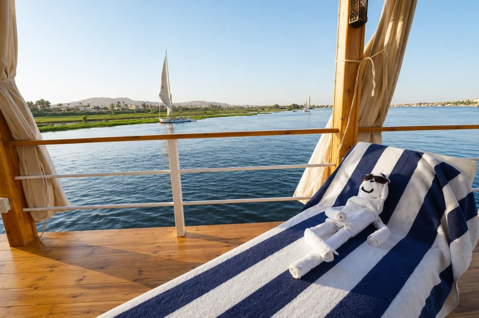 Sun lounger overlooking the Nile River aboard Turquoise Dahabiya Nile Cruise