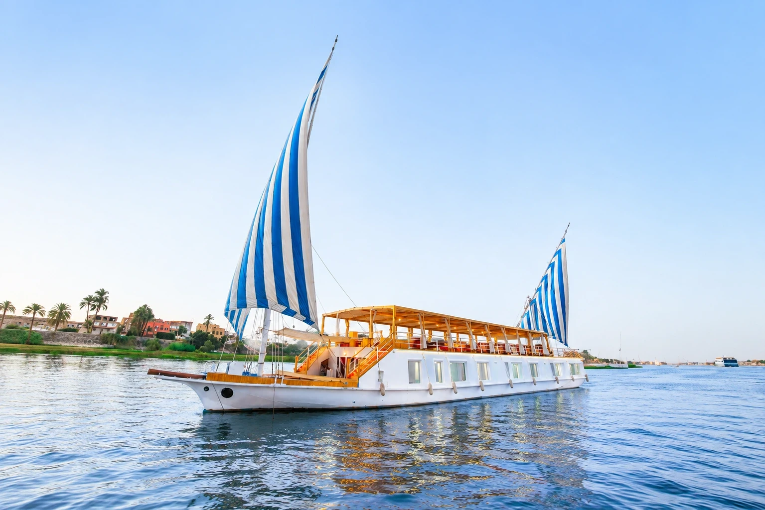 Turquoise Dahabiya Nile River Cruise sailing on the Nile