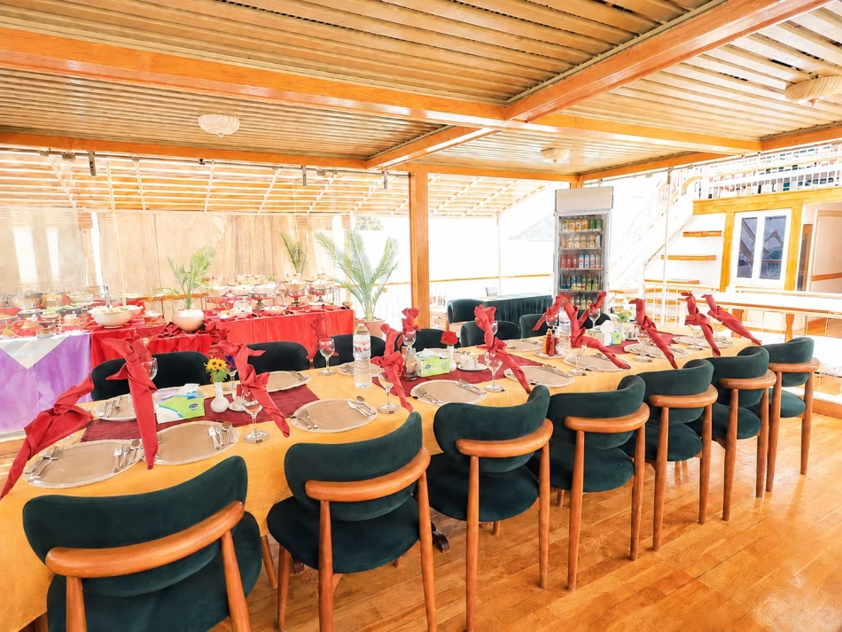 Dining area with tables and seating aboard Gorgonia Dahabiya Nile Cruise