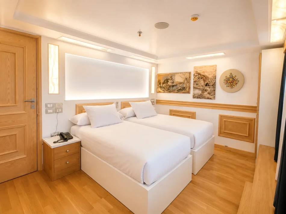 Interior view of a twin cabin aboard Gardenia Dahabiya Nile Cruise