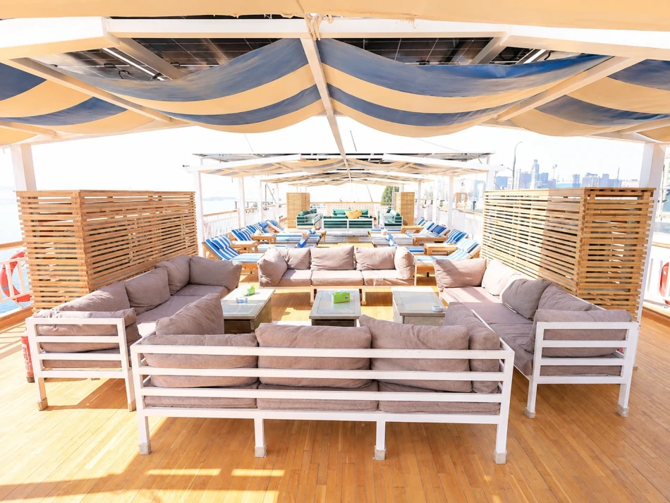 Shaded seating area on the sun deck of Gardenia Dahabiya Nile Cruise