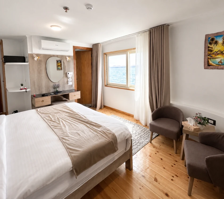 Double cabin with a large bed aboard Étoile d'Égypte Dahabiya Nile Cruise