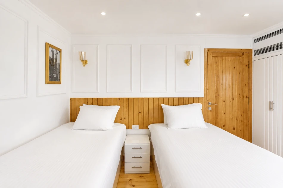 Twin cabin with two separate beds aboard Fatima Dahabiya Nile Cruise