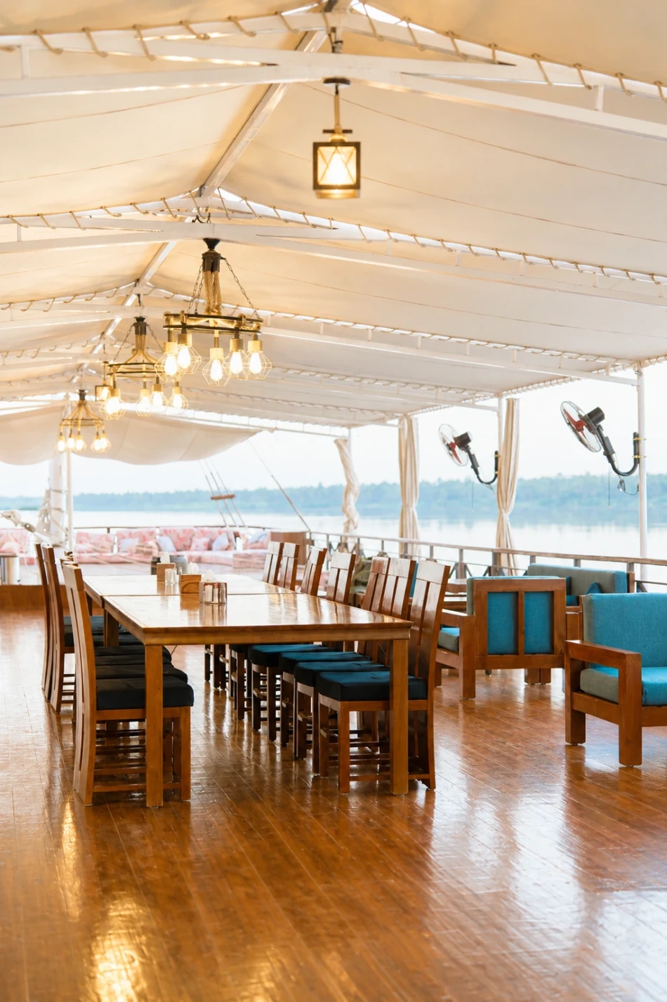 Open-air dining area on the sun deck of Fatima Dahabiya Nile Cruise