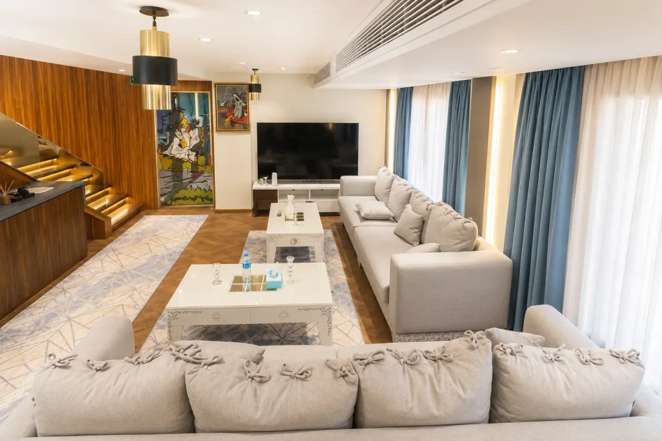 Indoor salon with sofa seating aboard Iris Dahabiya Nile Cruise