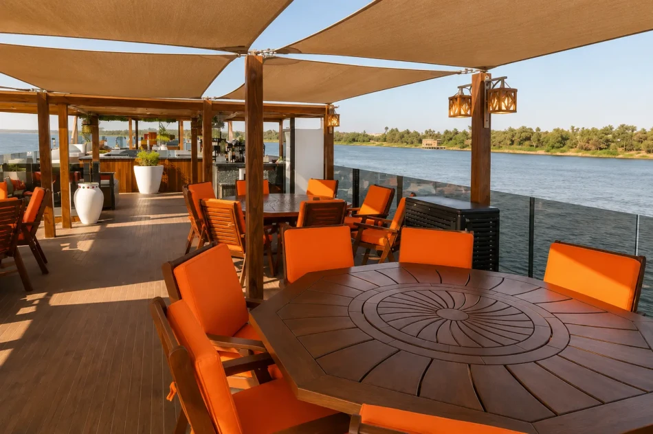 Open-air dining area on the sun deck of Iris Dahabiya Nile Cruise