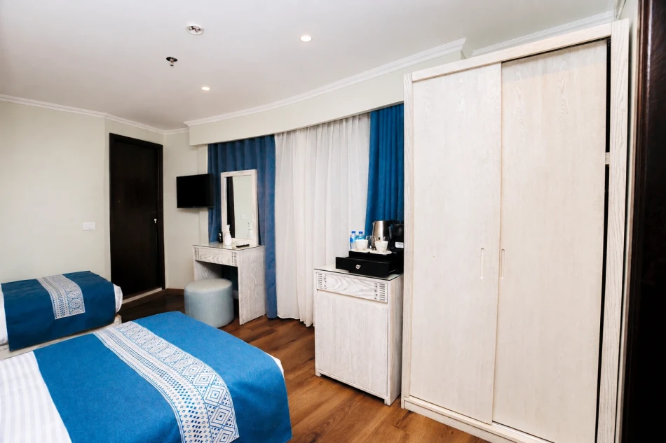 Twin cabin with two separate beds aboard Iris Dahabiya Nile Cruise