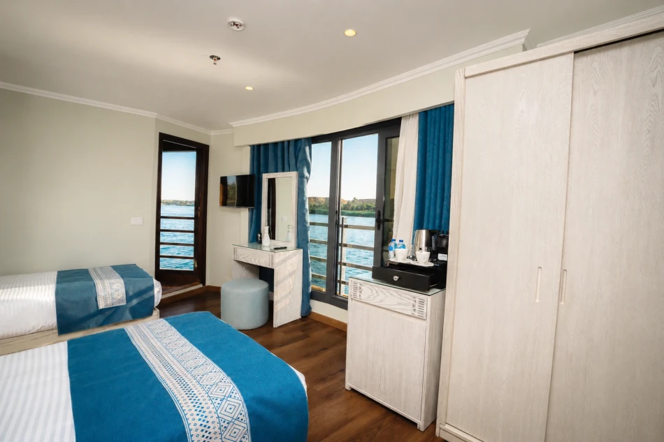 Spacious suite with a twin beds aboard Iris Dahabiya Nile Cruise