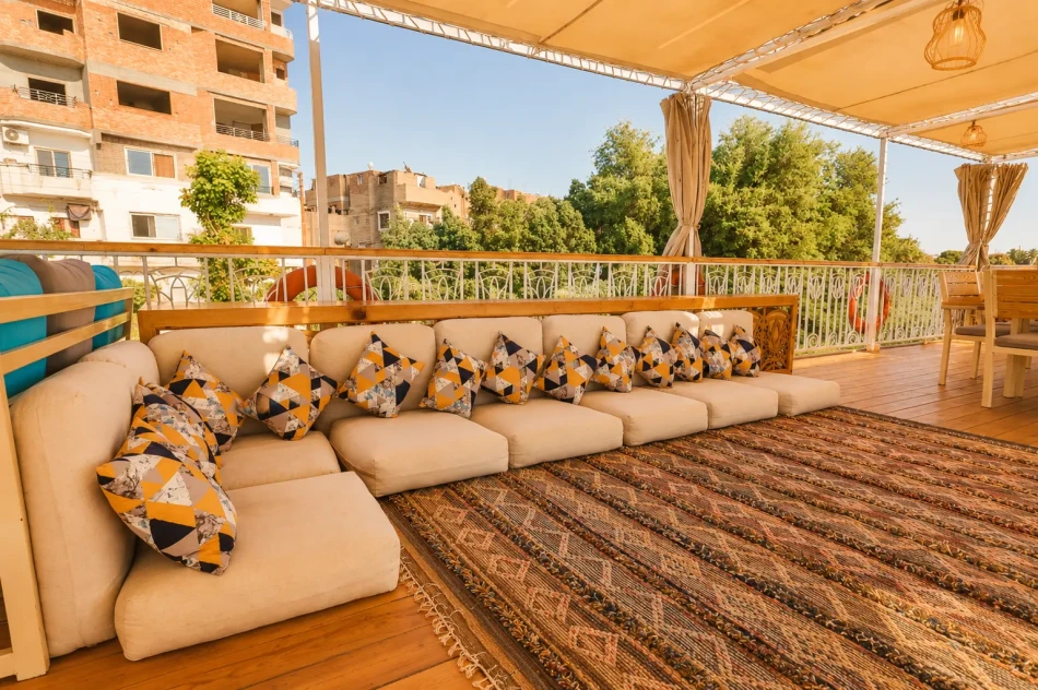Outdoor lounge seating on the sun deck of Sila Dahabiya Nile Cruise