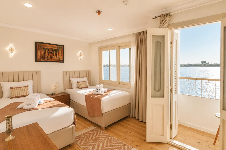 Twin suite with a large bed aboard Sila Dahabiya Nile Cruise