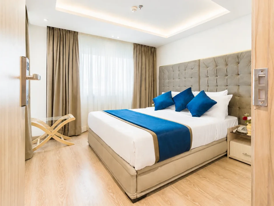 Double cabin with a large bed aboard Merit Dahabiya Nile Cruise