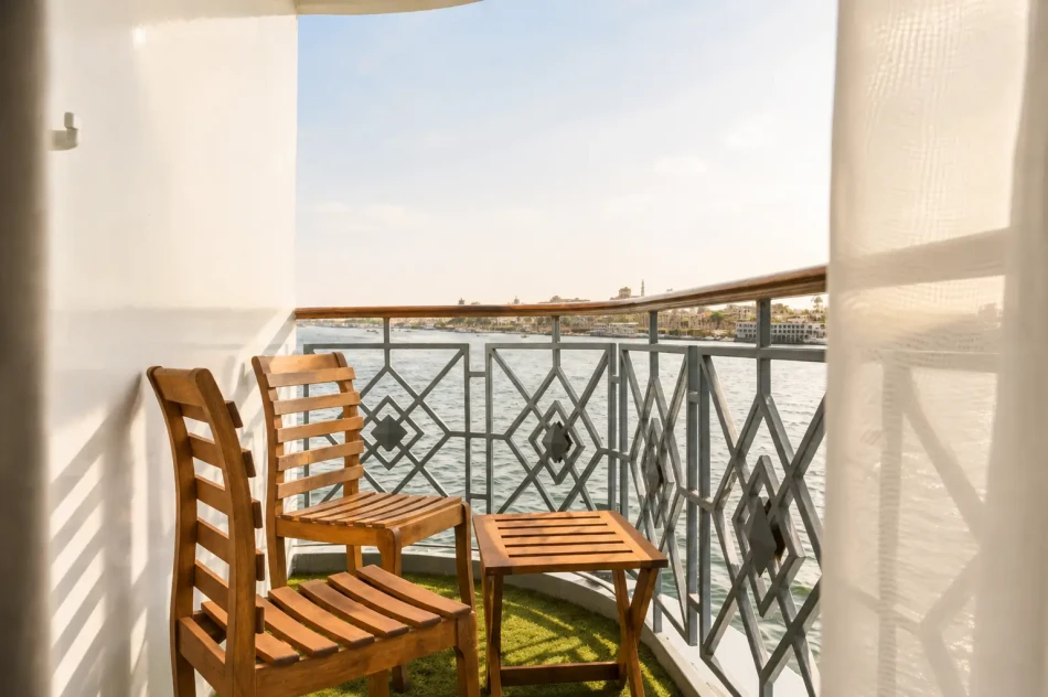 Private suite balcony with Nile River views aboard Merit Dahabiya Nile Cruise