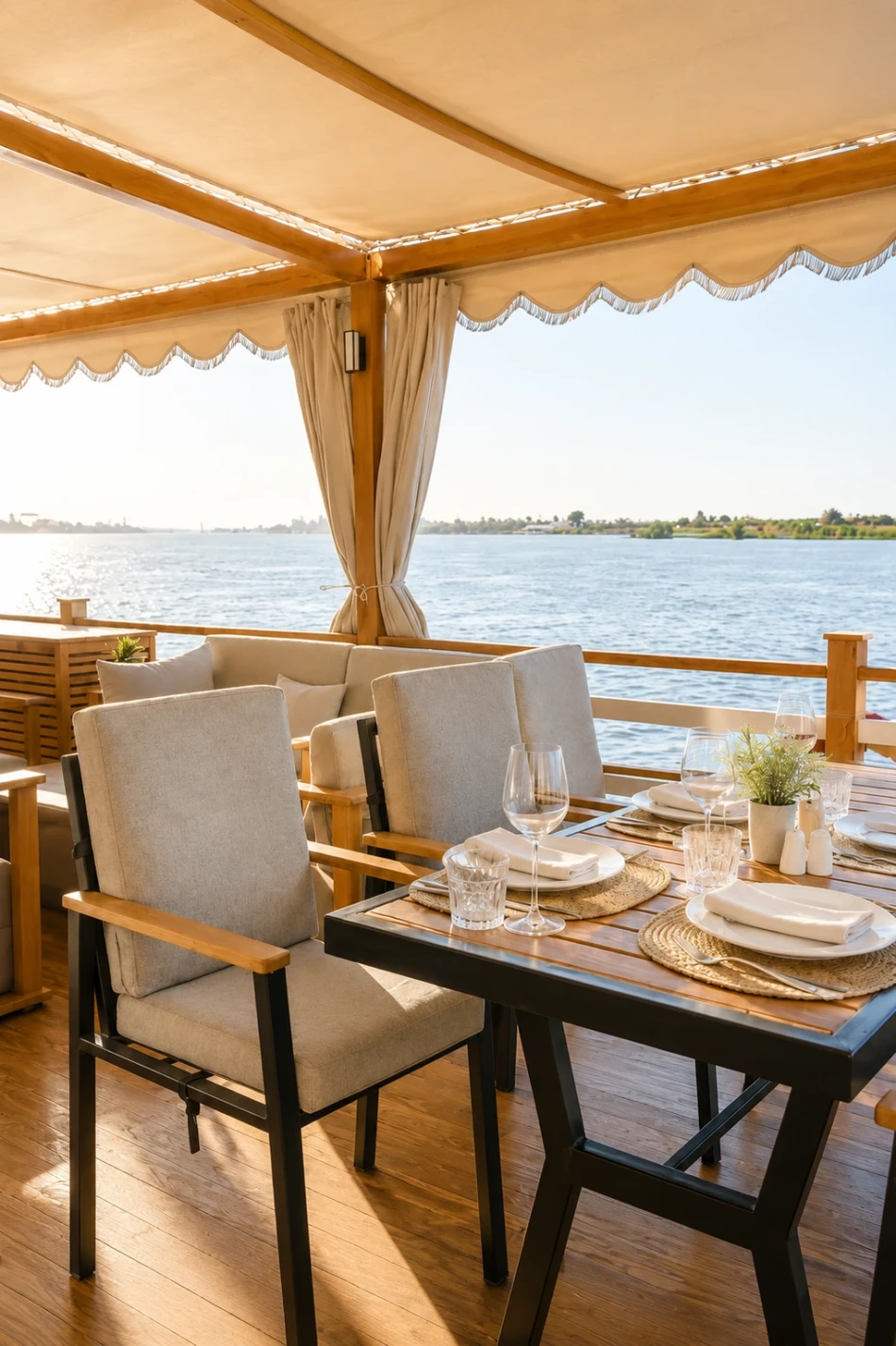 Open-air dining setup on the sun deck of Swan Dahabiya Nile Cruise