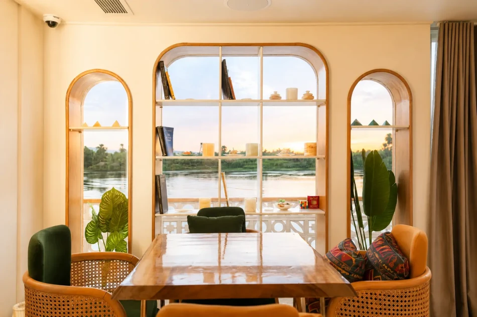 Indoor salon with Nile River views aboard Nayera Dahabiya Nile Cruise