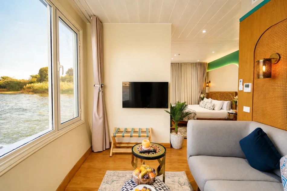 Suite panoramic interior with seating area aboard Nayera Dahabiya Nile Cruise