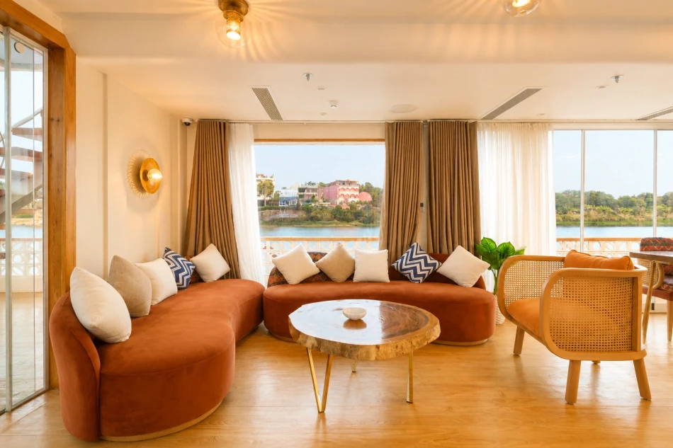 Lounge interior with sofa seating aboard Nayera Dahabiya Nile Cruise