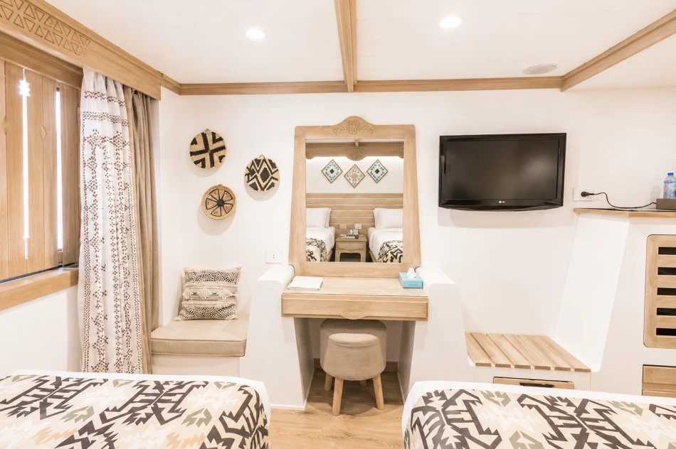 Cabin interior with vanity and television aboard Mahrousa Nile Cruise